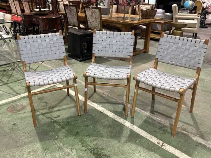 Set of three woven leather dining chairs
