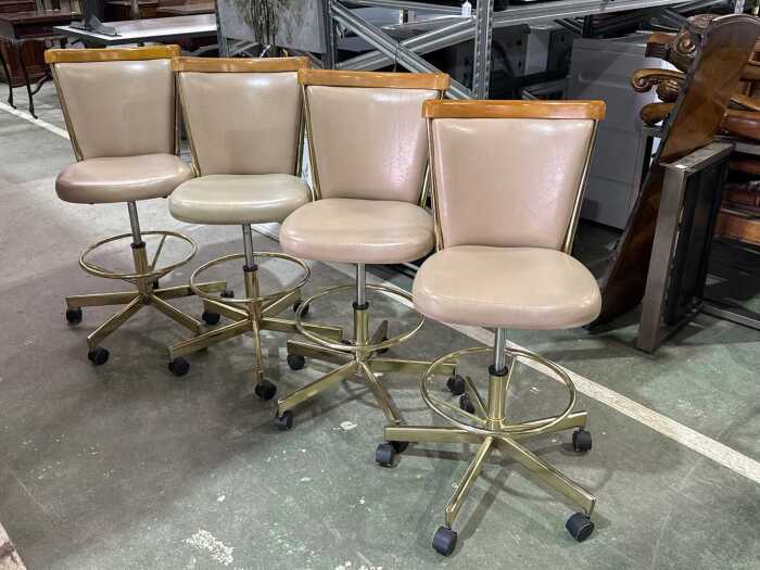 Set of four early swivel bar stools