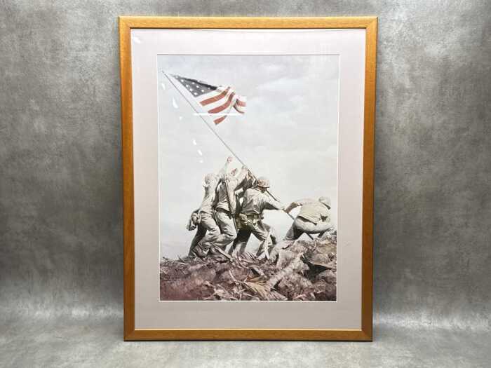 After Joe Rosenthal, Raising the Flag on Iwo Jima. Framed reproduction print on paper