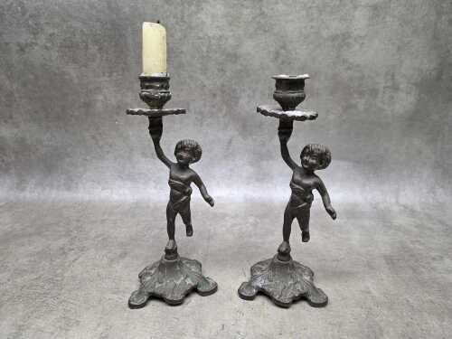 Pair of cast brass figural candlesticks