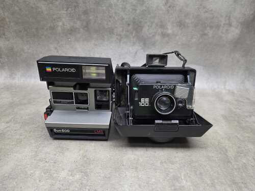 Two Polaroid instant cameras