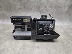 Two Polaroid instant cameras