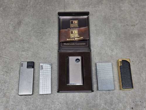 Five cigarette lighters, including Juvena