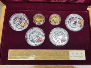 Three Beijing 2008 Olympics gold tone and silver tone souvenir medallion sets - 3