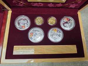 Three Beijing 2008 Olympics gold tone and silver tone souvenir medallion sets - 7