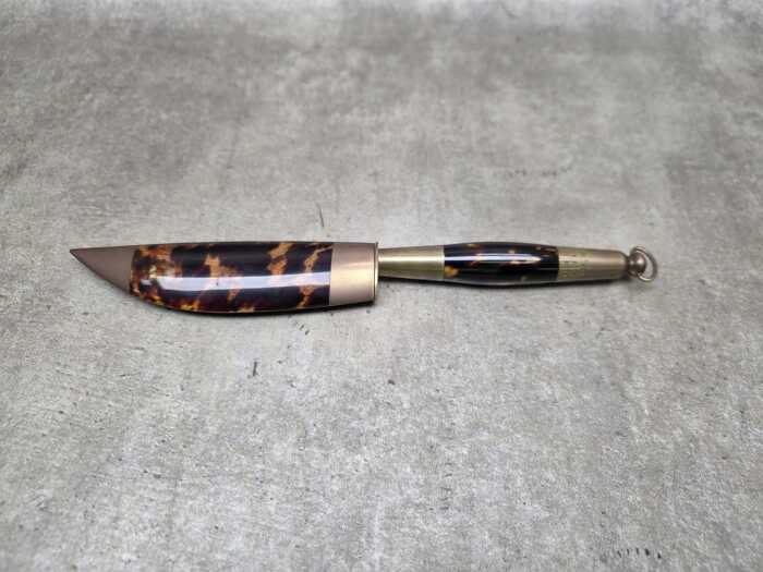 Decorative dagger and sheath with polished tortoiseshell and brass fittings