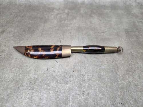 Decorative dagger and sheath with polished tortoiseshell and brass fittings