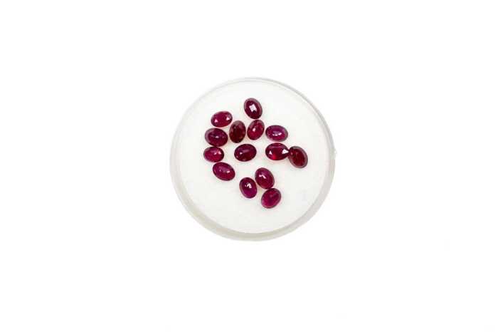 Fourteen oval natural rubies