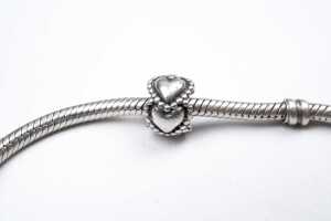 A pandora bracelet with three retired charms - 5