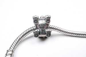 A Pandora bracelet with rare retired Winniper charm in sterling silver. - 4