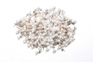 Large collection of freshwater pearl stud earrings in sterling silver.