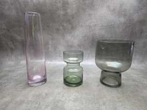 Three decorative art glass vases in various shapes