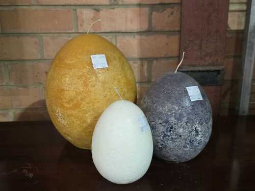 Three egg shaped textured decorative candles