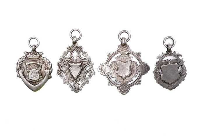 Four shields in sterling silver