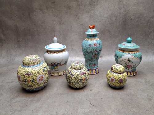 Six Oriental famille jaune and famille rose porcelain lidded ginger jars and lidded vase