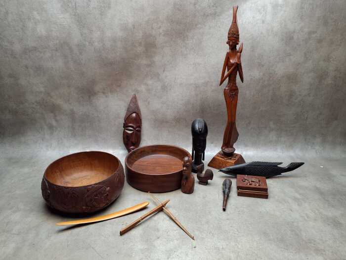 Ethnic timber items including Ebony bust and fish