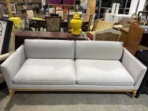 Contemporary grey upholstered three-seat sofa