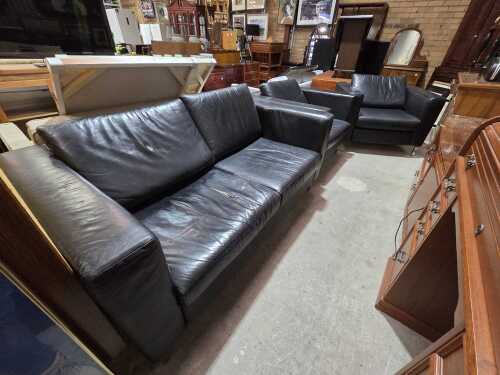Three-piece black leather lounge suite