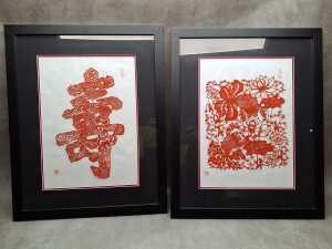 Pair of Chinese papercut pictures including goldfish and Chinese character