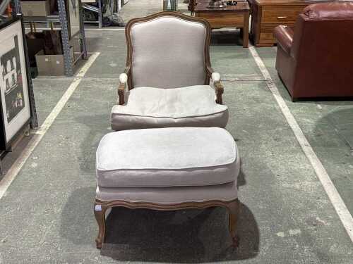 Cream upholstered occasional chair and ottoman