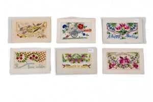 Six World War I silk embroidered postcards, mostly French