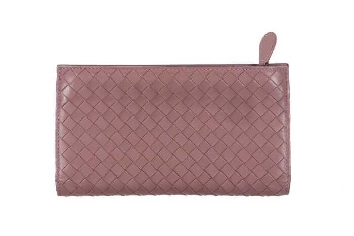 A Bottega Veneta Intrecciato long wallet in dusty pink