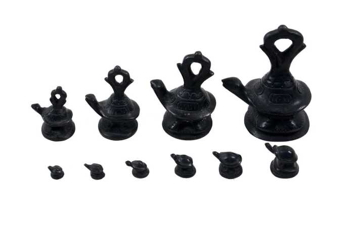 Burmese set of nine bronze opium weights surmounted by tortoise figures