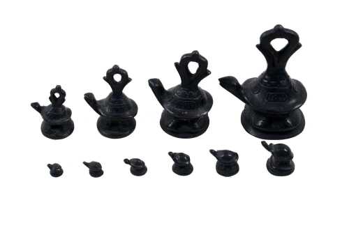 Burmese set of nine bronze opium weights surmounted by tortoise figures