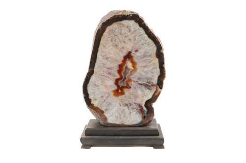 Polished natural agate geode featuring a crystalline centre