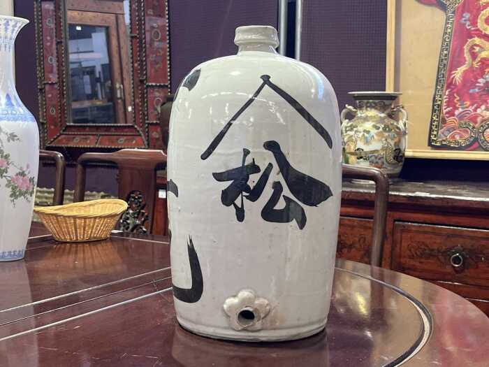 Antique Japanese Tokkuri ironstone sake bottle with plughole at the base and Kenji characters