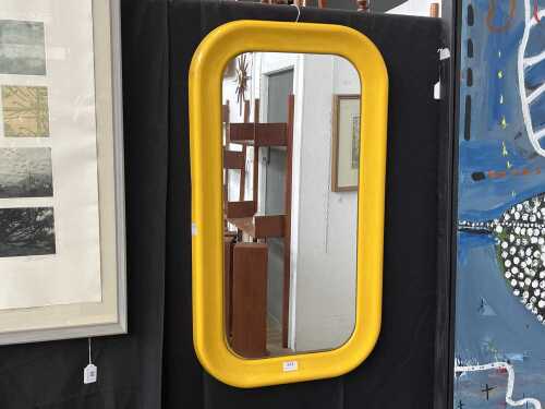 Mid-century space-age yellow tubular plastic wall mirror with rounded corners