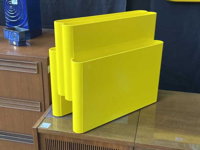 Kartell-style magazine rack in yellow