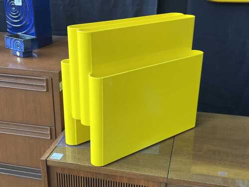 Kartell-style magazine rack in yellow