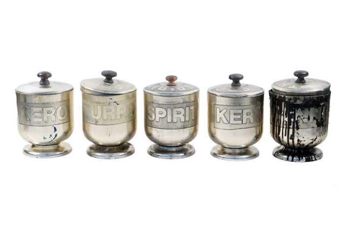 Five Don Shiel aluminium workshop canisters with raised text