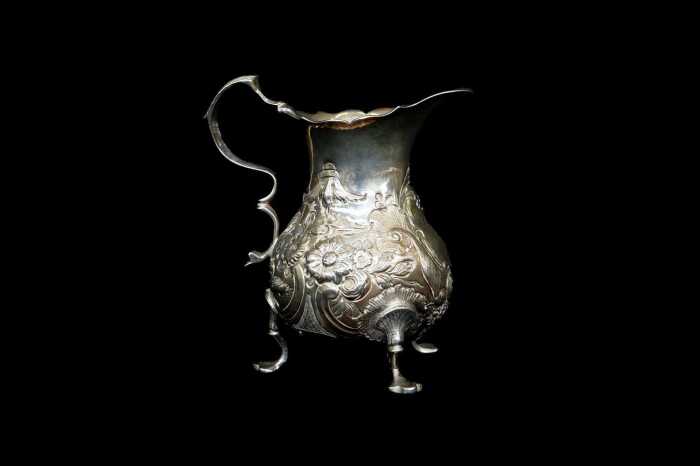 George II English sterling silver tri-footed creamer, 1759