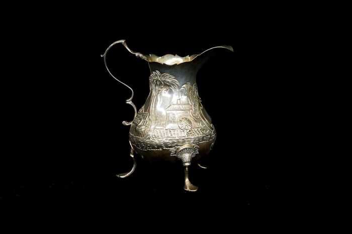George III English sterling silver tri-footed creamer, 1768
