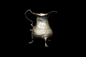 George III English sterling silver tri-footed creamer, 1768