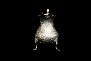 George III English sterling silver tri-footed creamer, 1768 - 2