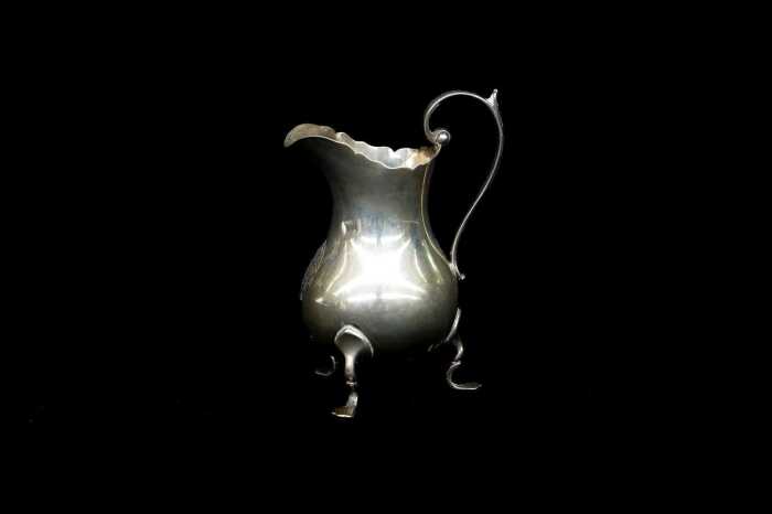 Late Victorian English sterling silver tri-footed creamer, weight 65g