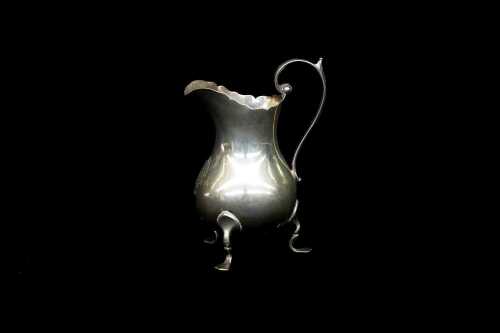 Late Victorian English sterling silver tri-footed creamer, weight 65g
