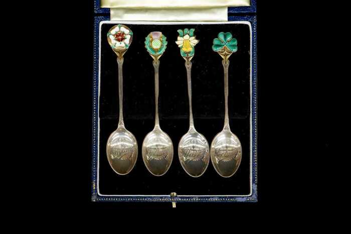 Set of four enamelled English sterling silver spoons depicting the floral emblems of the UK