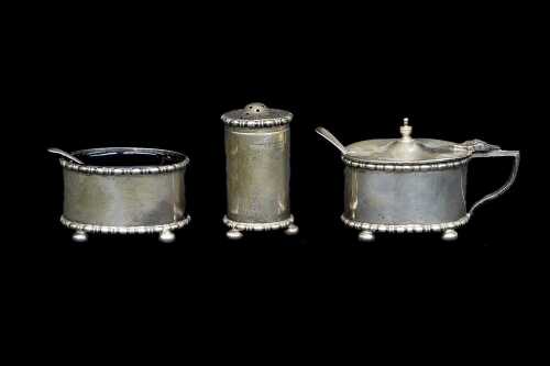 Antique English sterling silver three piece condiment set, weight excluding glass liners 99g