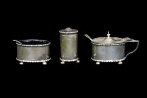Antique English sterling silver three piece condiment set, weight excluding glass liners 99g