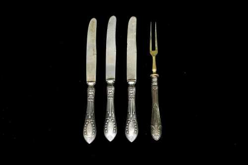 Three Latvian 875 silver dessert knives, plus an 875 silver mounted fork