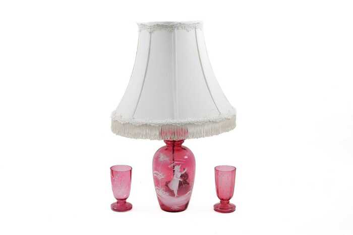 Mary Gregory style cranberry glass lamped vase, together with two glasses