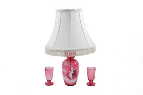 Mary Gregory style cranberry glass lamped vase, together with two glasses