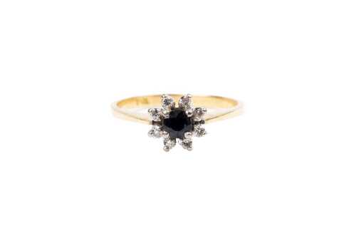 A sapphire and diamond ring in 18 carat yellow gold