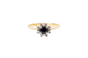 A sapphire and diamond ring in 18 carat yellow gold