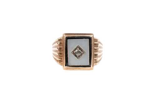 A vintage onyx, mother of pearl and white topaz signet ring in 9 carat yellow gold