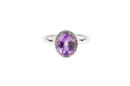 An amethyst and diamond ring in 9 carat white gold